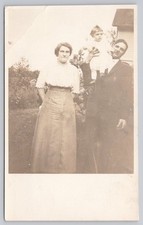 Vintage AZO RPPC Family Portrait Man Woman Baby 1900s Real Photo Postcard picture