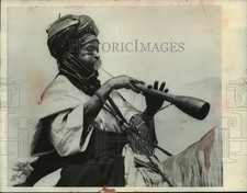 1956 Press Photo Mounted Nigerian Tribesman Blows 