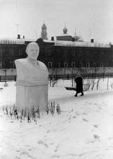 Russian woman walking near a bust of Lenin near Trinity Lavra of S- Old Photo picture