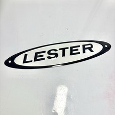 Vtg LESTER Buildings Embossed Tin Metal Sign Black White Advertising 10” picture