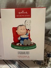 Hallmark CHRISTMAS IS ... Keepsake Ornament 2026 Peanuts Linus Snoopy picture