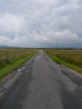 Photo A2 The B8025 Under Threatening Skies Bellanoch Rain clouds gather c2012 picture