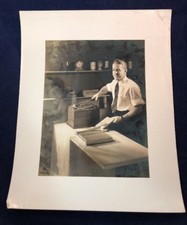 Vintage Black & White Photo Man In Shirt & Tie Cutting Binding Paper Office Work picture