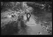 Photo:1930s Man Reaching to Boys in Creek Water Fishing Scene picture