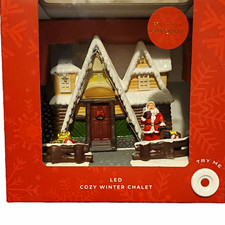 LED Illuminated Cozy Winter Chalet Christmas Village House with Santa, Boxed picture
