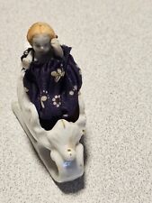 Small movable bisque doll in sled sled id made in japan . Christmas picture