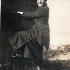 c1920s Smiling Woman Climbing Boxcar Ladder Snapshot Photo Train Railroad Coat picture