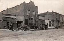 BUSY MAIN STREET SCENE Walkerton IN Indiana motorcycle RPPC Photo Postcard COPY picture
