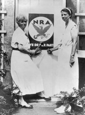 These two Americans are putting a National Recovery Act plaque doo- 1933 Photo picture