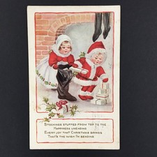 Antique Christmas Postcard Children Stuffing Stocking Whitney Made Posted 1917 picture