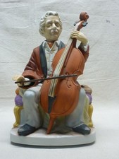 WACO MELODY IN MOTION THE CELLIST PORCELAIN MUSIC BOX FIGURINE picture